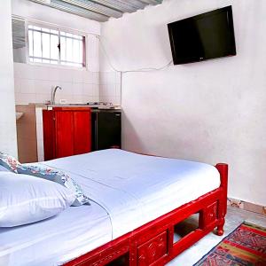 Llit o llits en una habitació de APARTAHOTEL BACANO LOFT