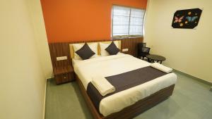 Hotel Hive Inn - Kozhikode客房内的一张或多张床位