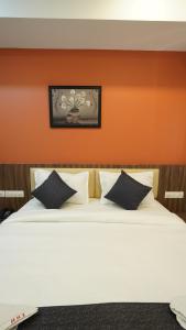 Hotel Hive Inn - Kozhikode客房内的一张或多张床位