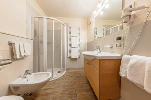 a bathroom with a sink toilet and a shower at Tlisöra Speckstube in Frena +48 photos