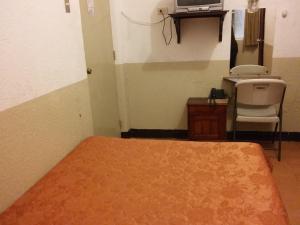 Postel nebo postele na pokoji v ubytování Hotel Centenario