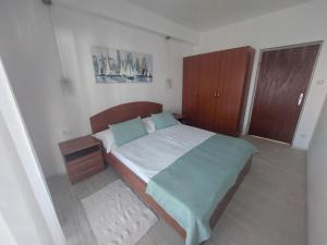 Postel nebo postele na pokoji v ubytování Apartments Amfora