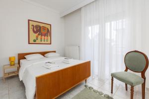 En eller flere senge i et værelse på Mimoza's Sea View Apartment