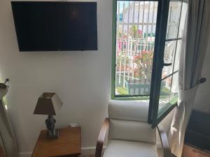 a living room with a couch and a window at 8 oDa Marmaris in Marmaris