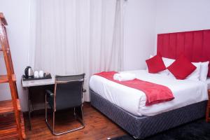 Postel nebo postele na pokoji v ubytování Safi Suites and Conference Centre