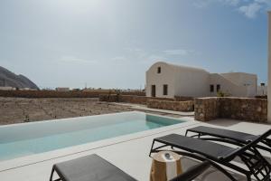 The swimming pool at or close to Rizes Villas Santorini with private pool