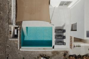 The swimming pool at or close to Rizes Villas Santorini with private pool