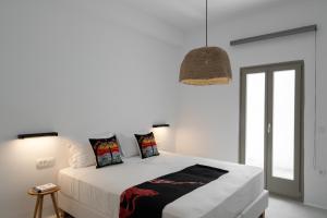 A bed or beds in a room at Rizes Villas Santorini with private pool