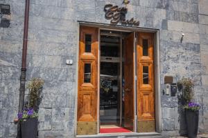 a door to a store with a sign above it at Casa Paolina in Lucca