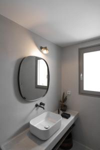 A bathroom at Rizes Villas Santorini with private pool