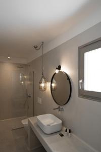 A bathroom at Rizes Villas Santorini with private pool