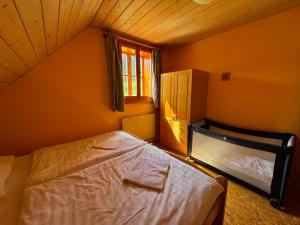 Postel nebo postele na pokoji v ubytování Apartmány Podťaté