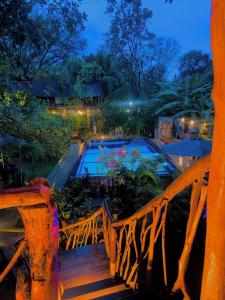 a view of a swimming pool at night at Levona Garden Resort in Habarana