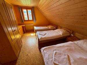 Postel nebo postele na pokoji v ubytování Apartmány Podťaté