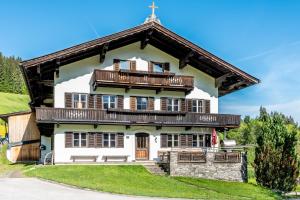 a house with a cross on top of it at Getznerhof in Westendorf