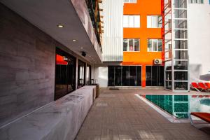 a lobby with a swimming pool in a building at Belsun Hotel in Beldibi