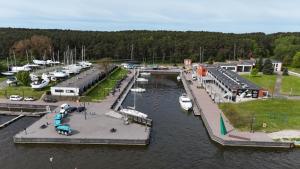 an aerial view of a marina with boats in the water at Smiltynės Jachtklubas in Klaipėda