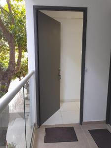 a door that is open to a building at Apartaestudio Cartagena 2P in Cartagena de Indias +21 photos