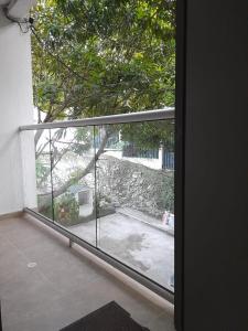 a sliding glass door with a view of a patio at Apartaestudio Cartagena 2P in Cartagena de Indias