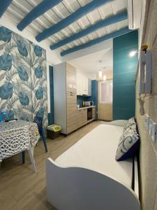 En eller flere senge i et værelse på Il Cristallo del mare