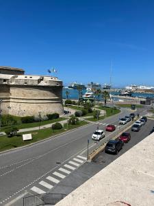 a street with cars parked on the side of a road at Casa Leandra in Civitavecchia +11 photos
