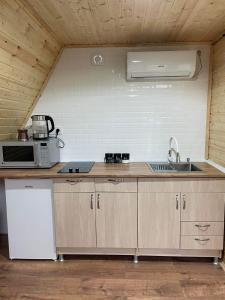 Kuchyň nebo kuchyňský kout v ubytování eco house WALKOTI