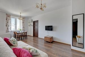 a living room with a couch and a table at Apartament Gdańsk in Gdańsk