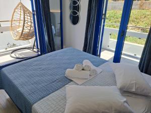 Ένα ή περισσότερα κρεβάτια σε δωμάτιο στο Aegean Apartments Evia