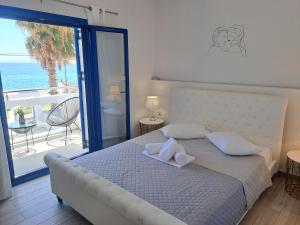 Ένα ή περισσότερα κρεβάτια σε δωμάτιο στο Aegean Apartments Evia