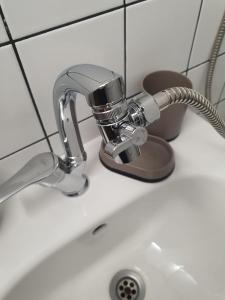 a bathroom sink with a faucet on a counter at HANCHO - KAPANA CENTER PLOVDIV in Plovdiv