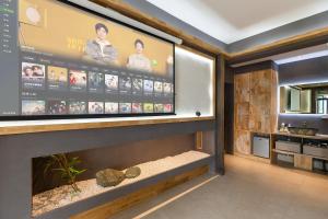 Kuchyň nebo kuchyňský kout v ubytování 重庆解放碑阳崽民宿高层新中式景观Youngzai Apt in Jiefangbei 5 + 28 fotografií