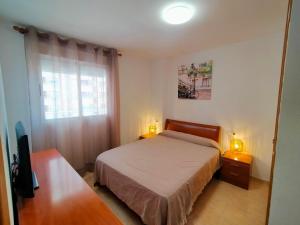 A bed or beds in a room at ACV - Costa Marina I-1ª linea planta 2 sur