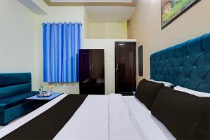 Krevet ili kreveti u jedinici u okviru objekta Hotel Maujis Inn