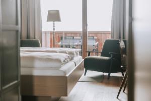 Ένα ή περισσότερα κρεβάτια σε δωμάτιο στο Hotel Marvia