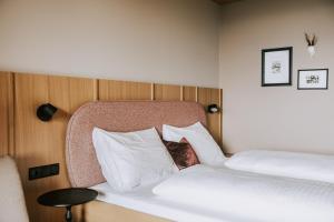 Ένα ή περισσότερα κρεβάτια σε δωμάτιο στο Hotel Marvia