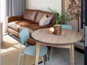 a living room with a table and a couch at Brooklyn Blok in Pretoria