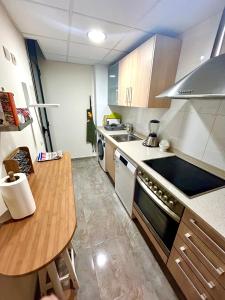 a small kitchen with a table and a counter top at Lo Gambussi Deltebre in Deltebre