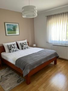 Postel nebo postele na pokoji v ubytování Apartman Dada