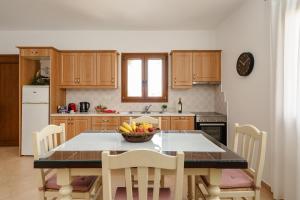 Η κουζίνα ή μικρή κουζίνα στο Rosabella Home