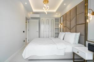 Postel nebo postele na pokoji v ubytování Edem Apartments