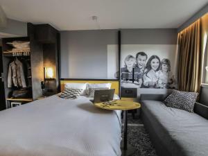 Postel nebo postele na pokoji v ubytování Ibis Styles Clermont-Ferrand République