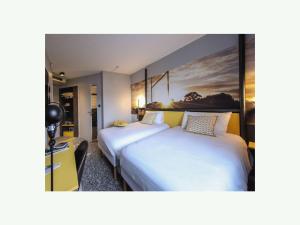 Postel nebo postele na pokoji v ubytování Ibis Styles Clermont-Ferrand République