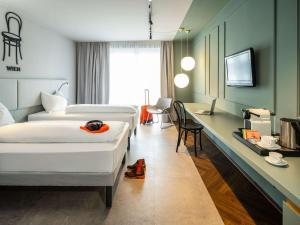 Letto o letti in una camera di ibis Styles Graz Messe
