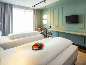Letto o letti in una camera di ibis Styles Graz Messe