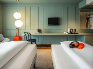 Letto o letti in una camera di ibis Styles Graz Messe