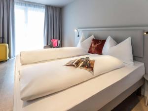 Letto o letti in una camera di ibis Styles Graz Messe