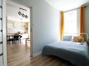 Posteľ alebo postele v izbe v ubytovaní Apartamenty KDN na Rysiej