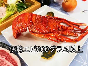 a lobster on a white plate on a table at Ikaho Kids Paradise Hotel - Vacation STAY 56072v in Shibukawa