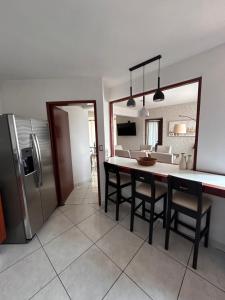 a kitchen and dining room with a table and a refrigerator at "Condominio Américas" in Boca del Río