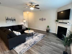 a living room with a couch and a fireplace at Belvedere in Anderson